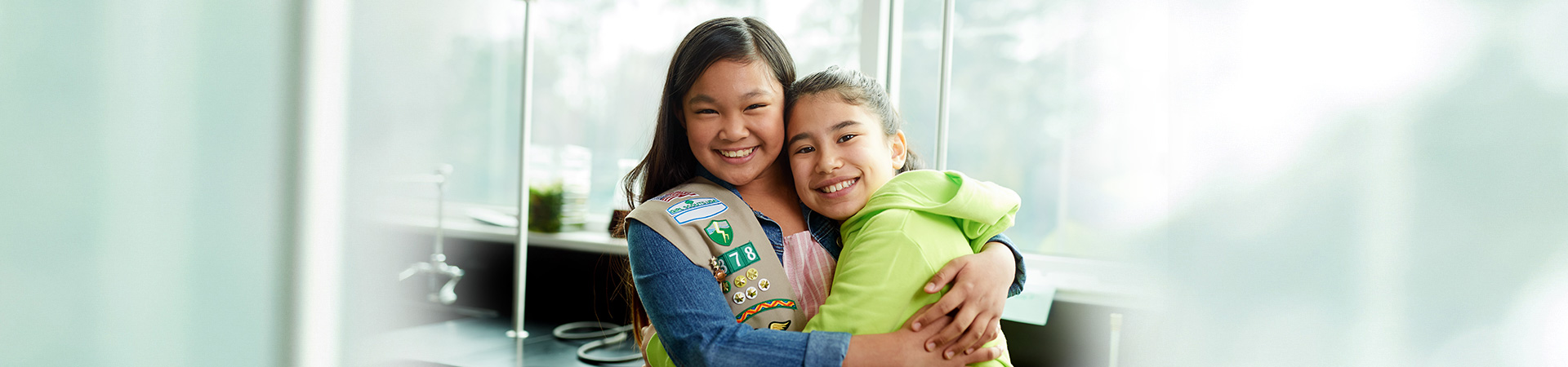  girl scout alum adult women retirement age smiling at camera 